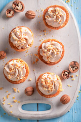 Tasty mini tartlets made of cream and walnuts.