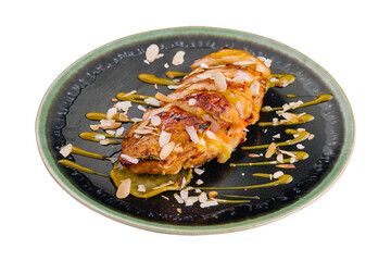 chicken tenderloin with roasted almonds on plate