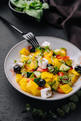 Greek salad with feta cheese, olives and vegetables