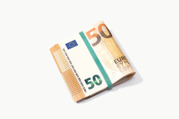 Folded euro banknotes isolated on white background