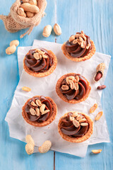 Tasty mini tartlets with butterscotch and nuts.