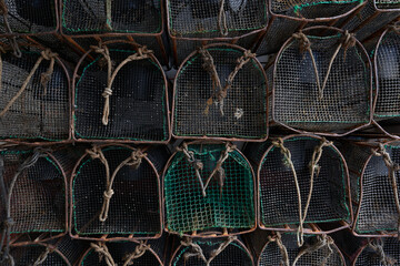 Atlantic fishing trap detail in the port waiting to be loaded onto the ship. Metal and plastic baskets to fish.