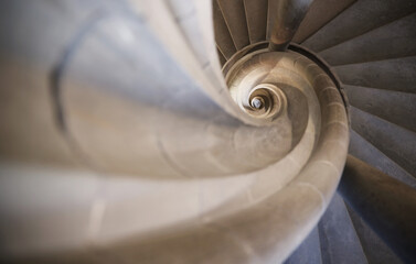 Stone spiral stairway in old building abstract photo
