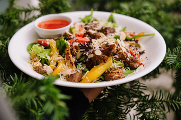 Salad with warm veal and vegetables