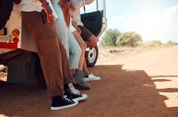 Legs, travel and friends on a road trip with a car for holiday in Kenya together during summer. Feet of a group of people on vacation for adventure, freedom and peace with a car in the countryside