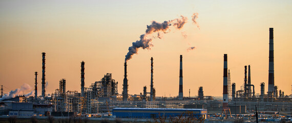 Working oil refinery. Smoke from the factory chimney. Ecological pollution. Air emissions polluting...