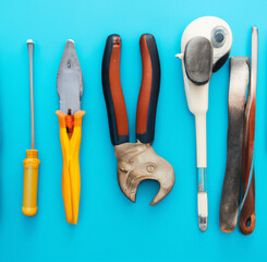 handicraft construction tools on blue background