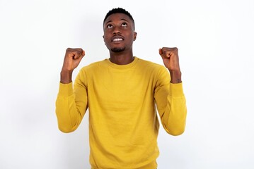 Young champion having success being glad to achieve his goals. Victory and triumph concept.