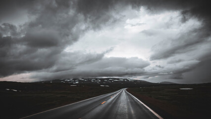 Road in Arctic Norway, on a dark rainy day
