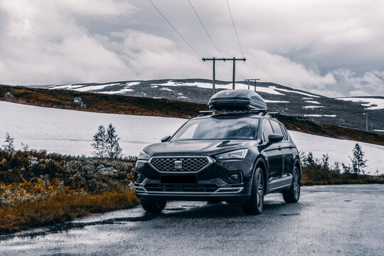 Storforshei, Norway - July 27 2020: A black Seat Tarraco with a roof box, during a road trip in Norway