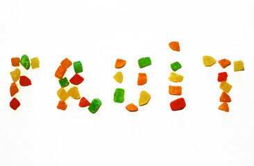 The word FRUIT is laid out with colored candied dried fruits