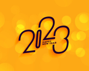 happy new year 2023 yellow background with bokeh effect