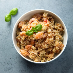 Healthy quinoa bowl with shrimps and basil