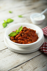 Homemade Bolognese sauce with fresh basil