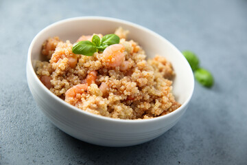 Healthy quinoa bowl with shrimps and basil