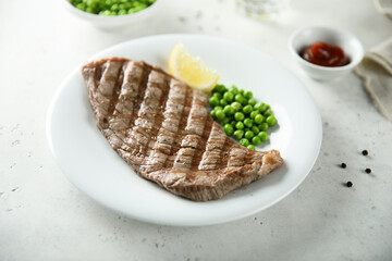 Grilled beef steak with green pea