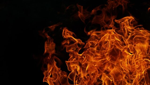 Super slow motion of fire blast isolated on black background. Filmed on high speed cinema camera, 1000 fps. Speed ramp effect.