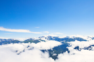 mountain peaks above the clouds