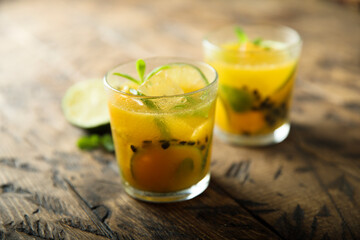 Refreshing passion fruit cocktail with lime
