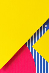 Texture background of fashion papers in memphis geometry style. Yellow, blue, pink, white colors, striped and polka dot pattern. Top view, flat lay