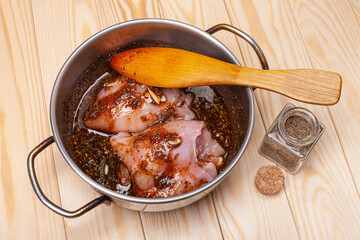 pieces of raw meat filled in soy marinade with garlic and spices, ready for cooking
