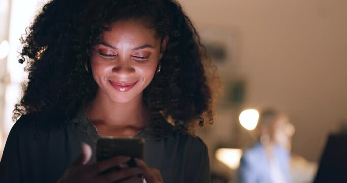 Social media, phone and happy woman typing on a dating app or website for a love connection and romance. Smile, relaxed and young woman texting, chatting and online dating in a dark night at home