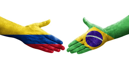 Handshake between Brazil and Colombia flags painted on hands, isolated transparent image.
