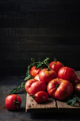 Fotobehang Freshly picked ripe red organic tomatoes. © Nataliia Sirobaba