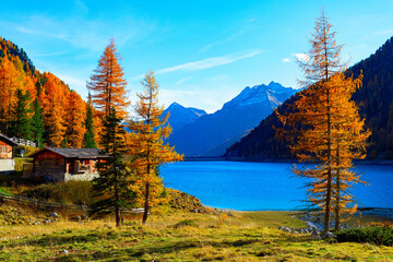 Autumn lake Alps hut mountains