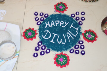 happy diwali written with colorful rangoli
