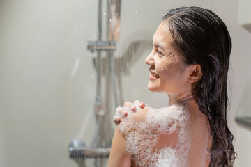 Woman bathing and washing her hair relaxed..