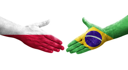 Handshake between Brazil and Poland flags painted on hands, isolated transparent image.