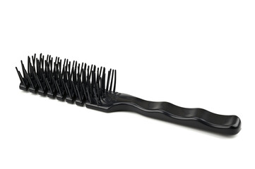 A black hairbrush used to detangle hair