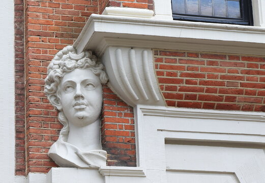 Huis met de Hoofden Historic Building Facade Detail with Sculpted Head of the Goddess Diana in Amsterdam, Netherlands
