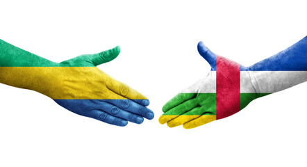 Handshake between Central African Republic and Gabon flags painted on hands, isolated transparent image.