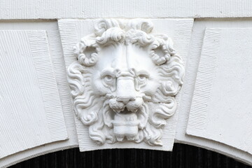 Sculpted White Lion Head Detail Above an Entrance of a Historic Keizersgracht Canal Building in...