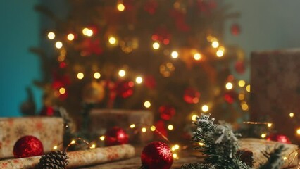 Hand of a man is preparing the Christmas table with gift