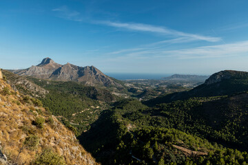Sierra de Bernia y Ferrer mountains and Mediterranean pine forest from Bolulla village, Alicante, Spain