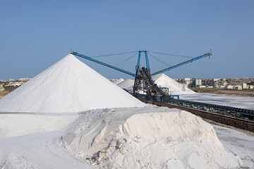 Salt mine mountains and crane at sea salt industry in Torrevieja, Spain