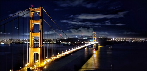 Closeup of the Golden Gate Bridge at night in San Francisco, USA