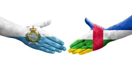 Handshake between Central African Republic and San Marino flags painted on hands, isolated transparent image.