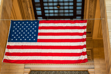 Close-up of the US national flag inside the Central Station building in New York