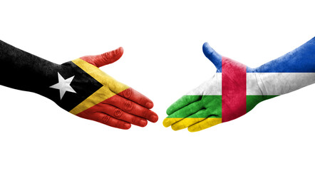 Handshake between Central African Republic and Timor Leste flags painted on hands, isolated transparent image.