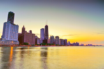 Fototapeta na wymiar View of Chicago skyline from the shore of Lake Michigan at sunset.