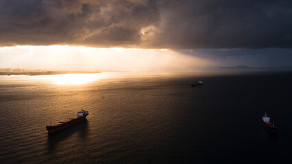 Naklejka na ściany i meble aerial view of cargo ship in sea of marmara in cloudy morning day