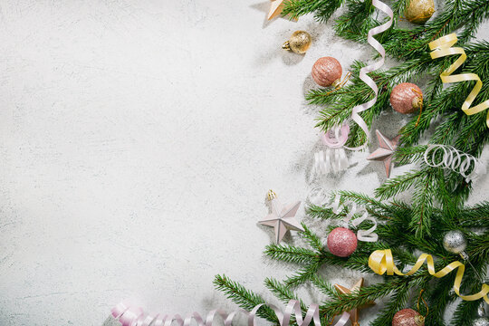 Christmas holiday background with decorations and green branches top view copy space