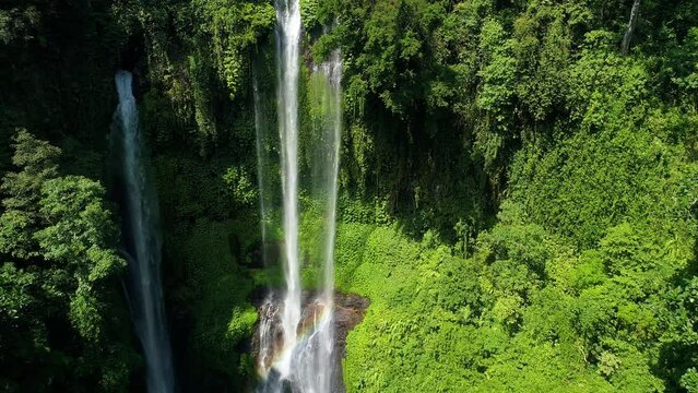 Waterfall with rainbow on Bali aeral view