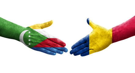 Handshake between Chad and Comoros flags painted on hands, isolated transparent image.