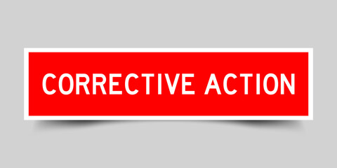 Square label sticker with word corrective action in red color on gray background
