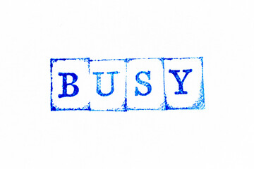 Fototapeta premium Blue color ink rubber stamp in word busy on white paper background